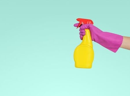 a hand holding a bottle
